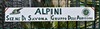 Gate sign with Alpine crests.